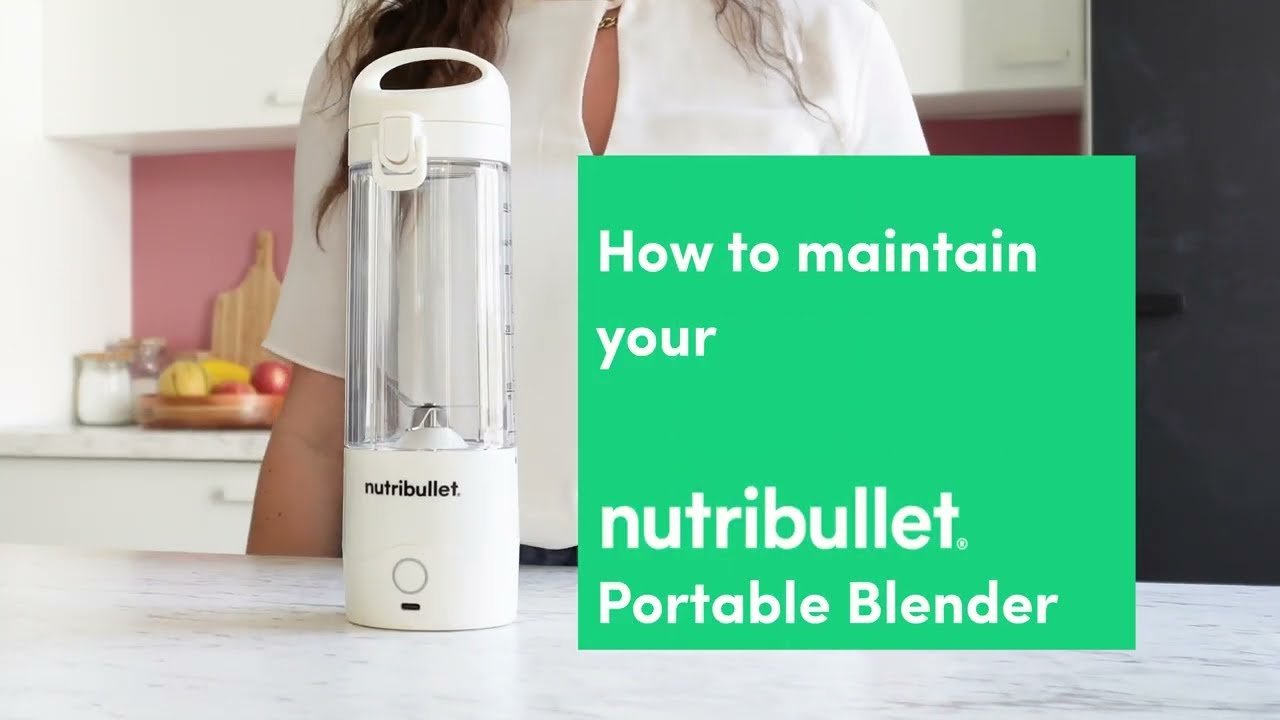 A portable blender and smoothie on a bright kitchen counter