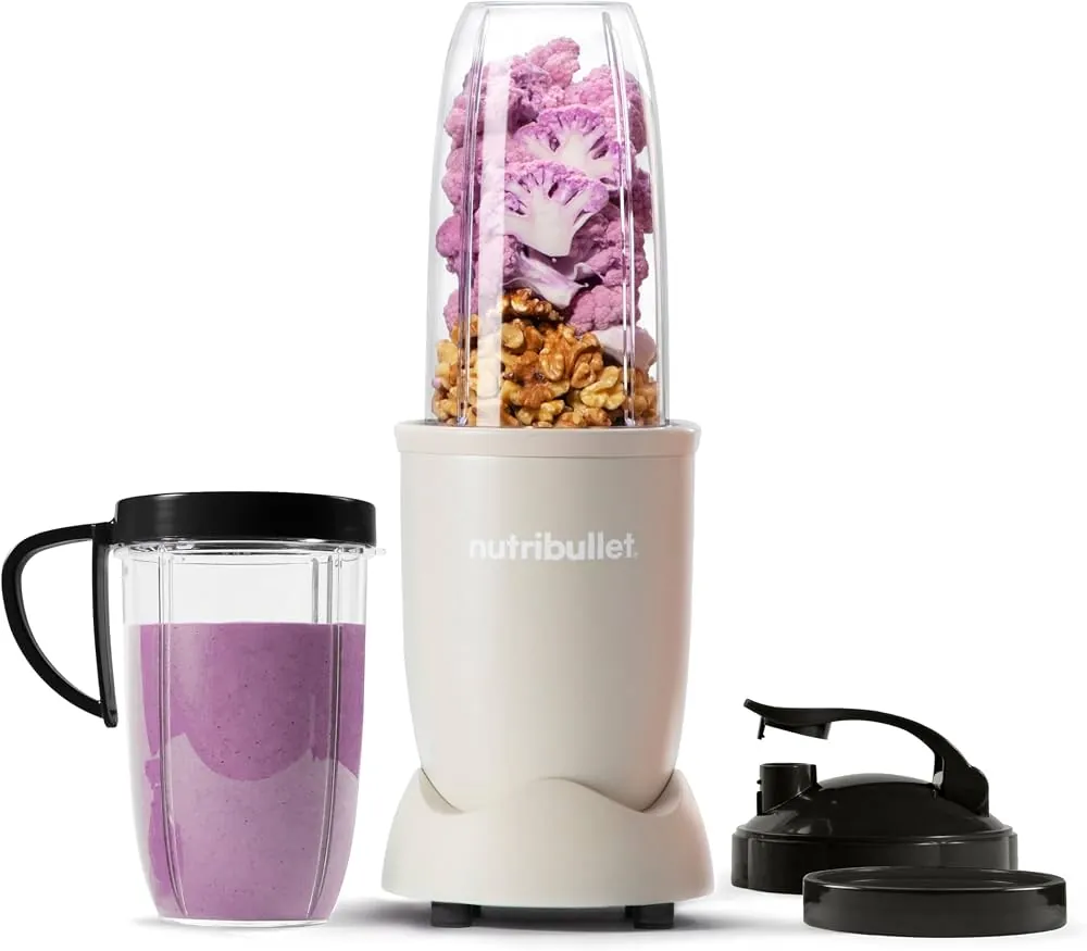 Pouring milk into a blender cup before adding frozen fruit