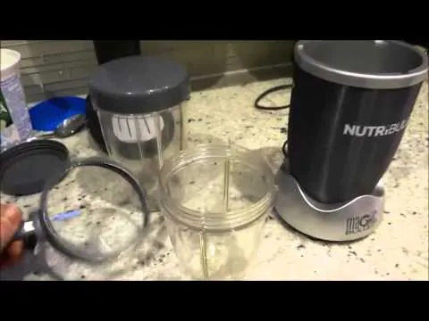 Rinsing Nutribullet blender cup and blade at kitchen sink
