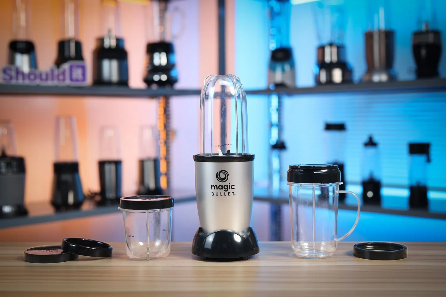 Small personal blender beside a single serving berry smoothie