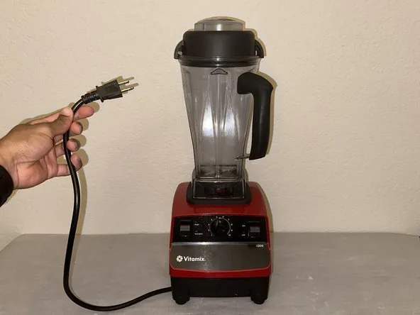 Stopped Vitamix blender sitting on a home kitchen island ready for inspection