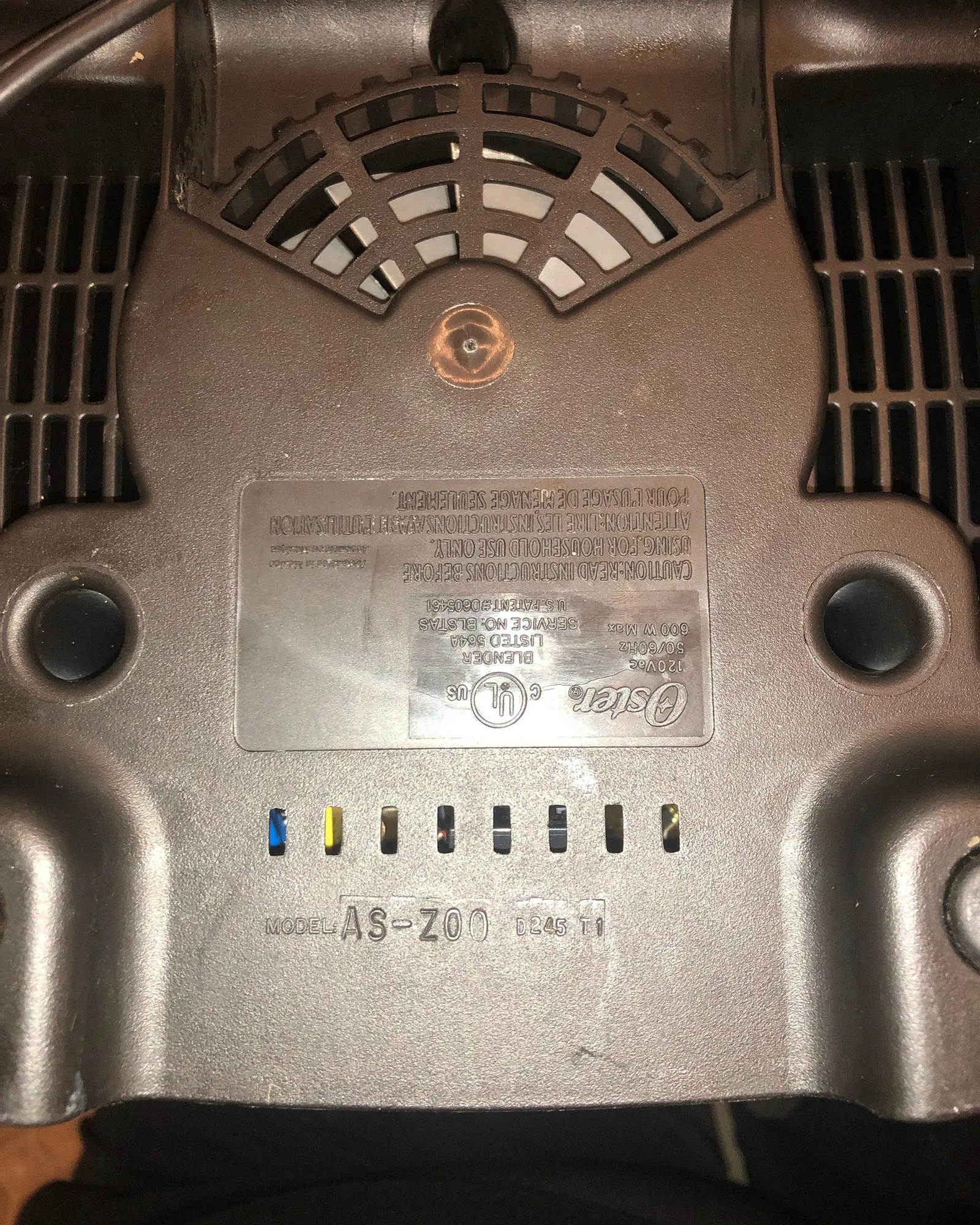 Three Oster blender models lined up showing different label locations
