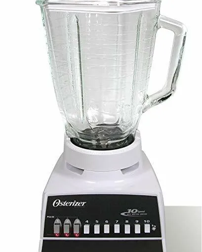 Three people using an Oster 10-speed blender in a kitchen