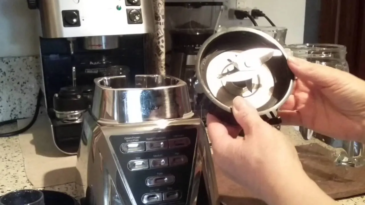 Two Oster blender jars showing threaded metal cap and plastic collar