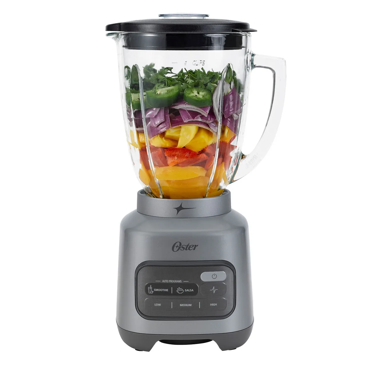 Two-thirds full blender jar showing layered smoothie ingredients ready to blend
