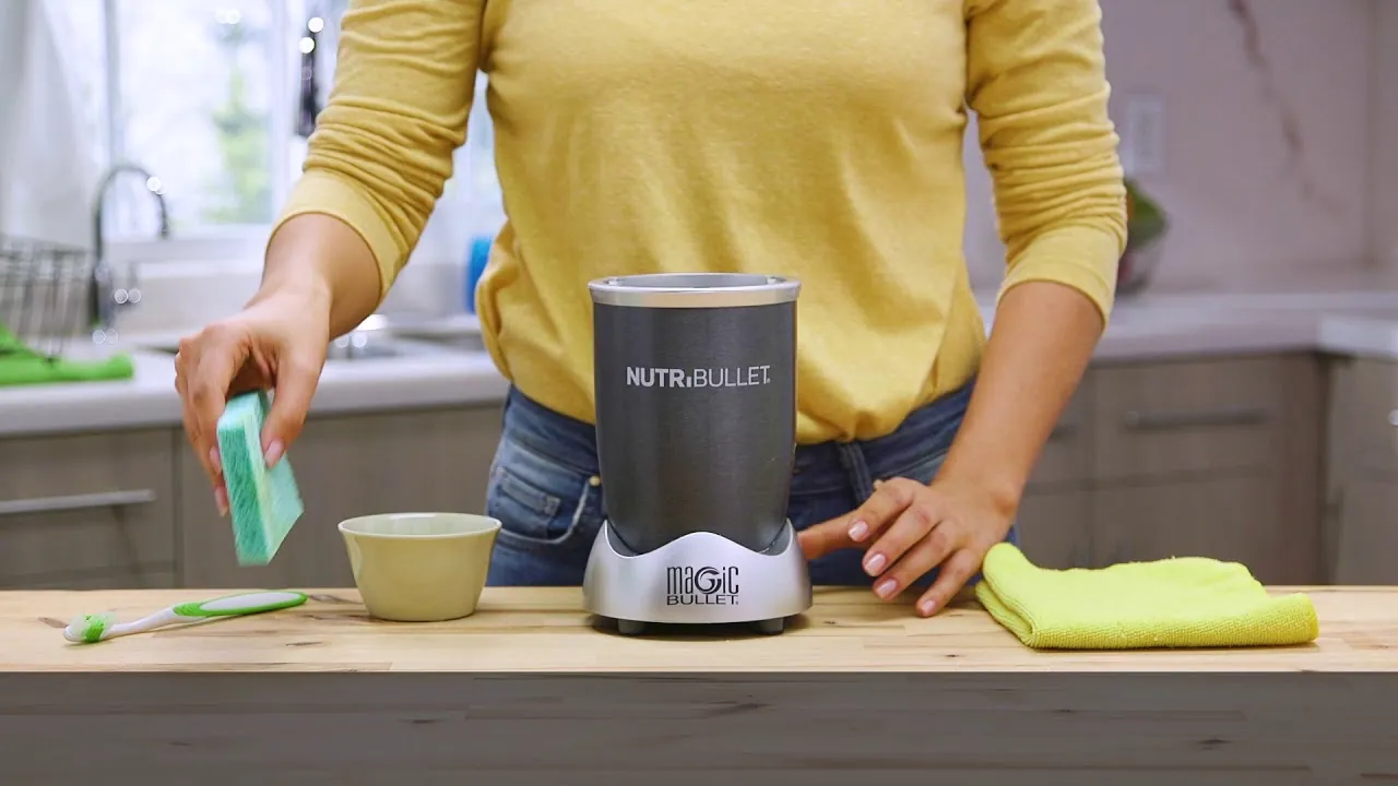 Unplugged Nutribullet motor base on a counter with cord coiled nearby