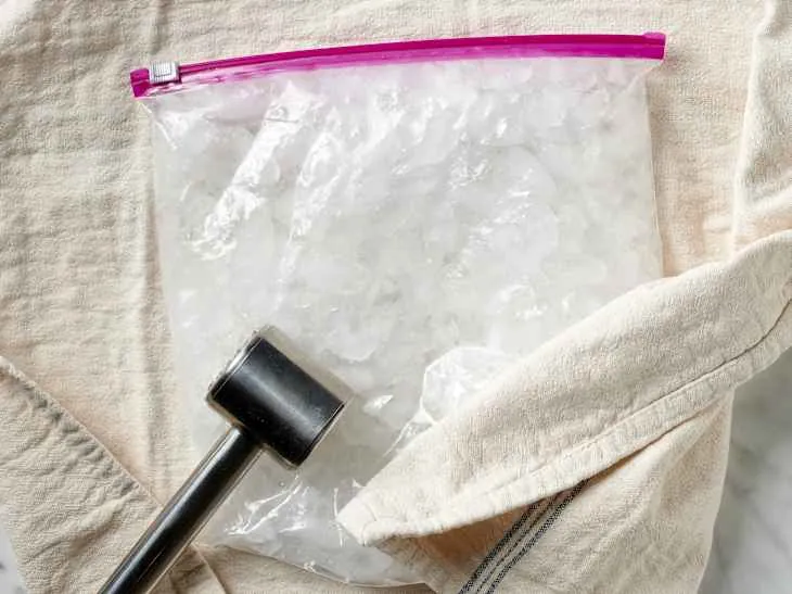 Variety of frozen ingredients like ice and fruit prepared for blending