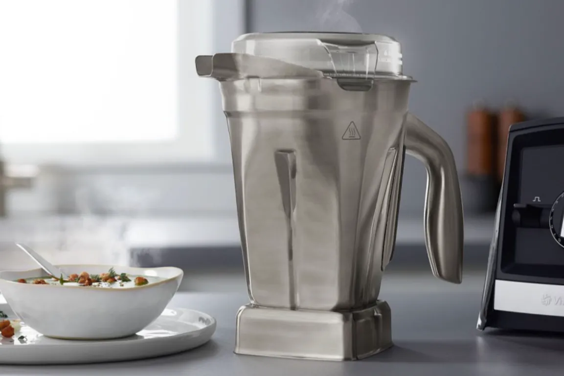 Velvety smooth almond butter inside a blender container showing high-quality blending results.