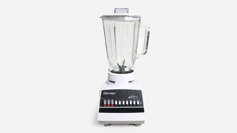 Vintage chrome Osterizer blender on a bright kitchen counter with fresh oranges