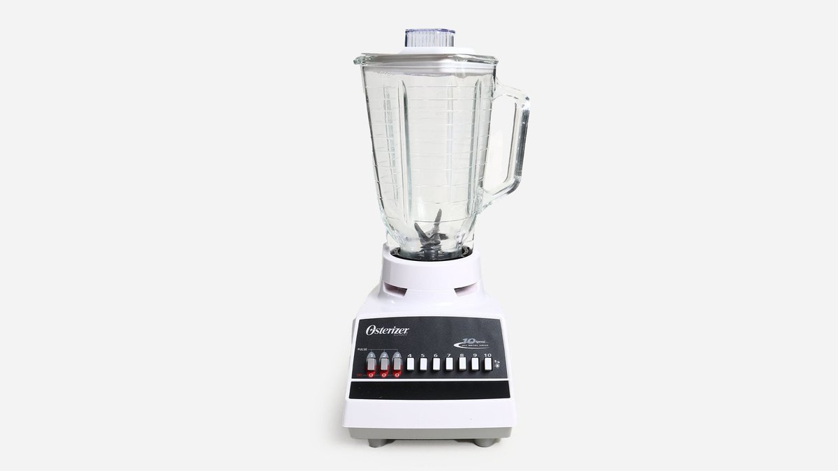 Vintage chrome Osterizer blender on a bright kitchen counter with fresh oranges