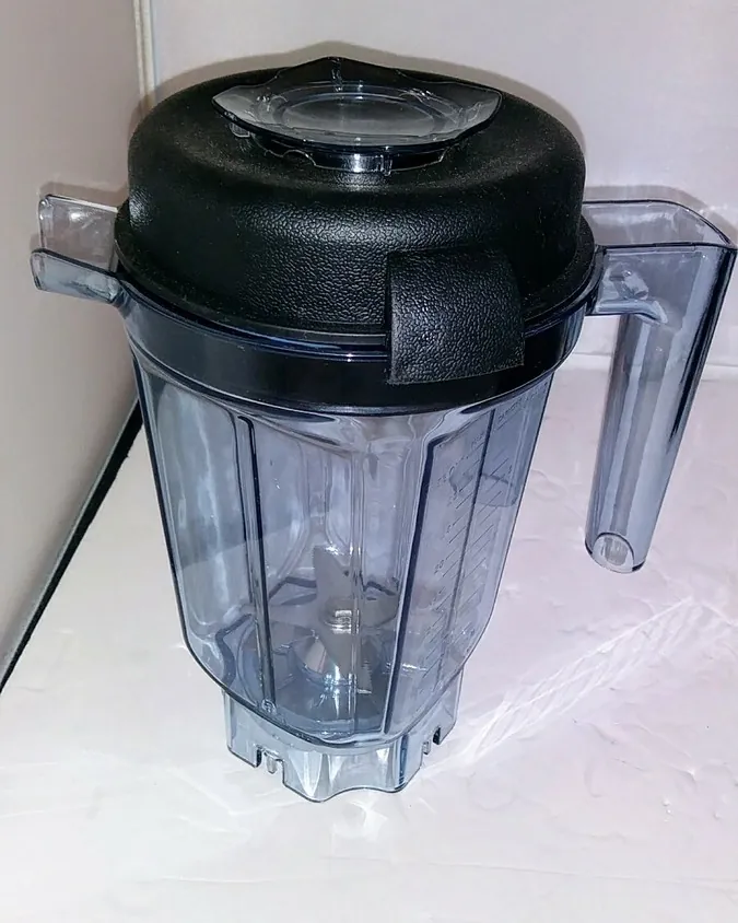Vitamix blender base drive socket and blade assembly showing misalignment indicating a mechanical failure beyond simple assembly.