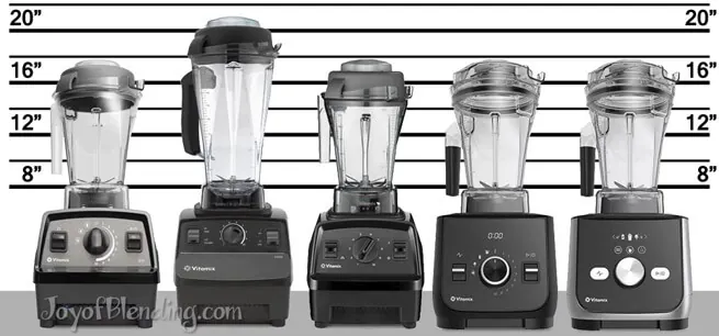 Vitamix blender beside a gritty protein shake on a marble kitchen counter