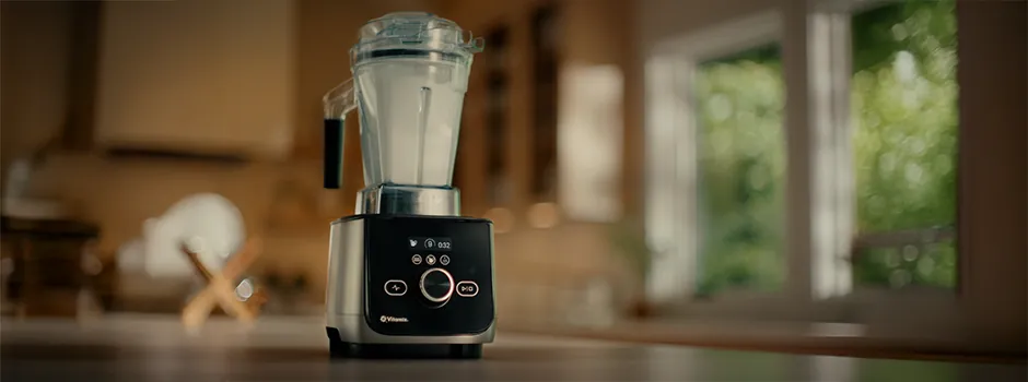 Vitamix blender cleaning with warm soapy water and spinning blades