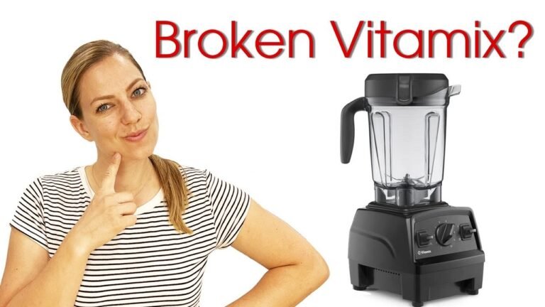 Vitamix blender on a marble countertop in a sunlit modern kitchen with soft natural lighting.