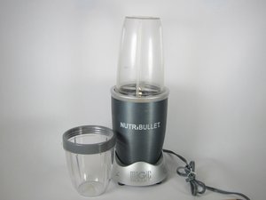 White Nutribullet blender and blade assembly on a kitchen counter