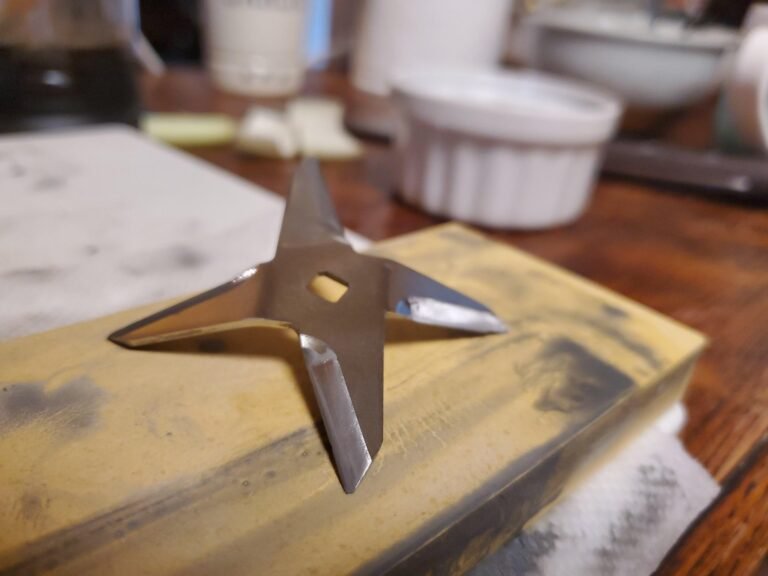 Worn Vitamix blender blades on a kitchen counter showing need for maintenance