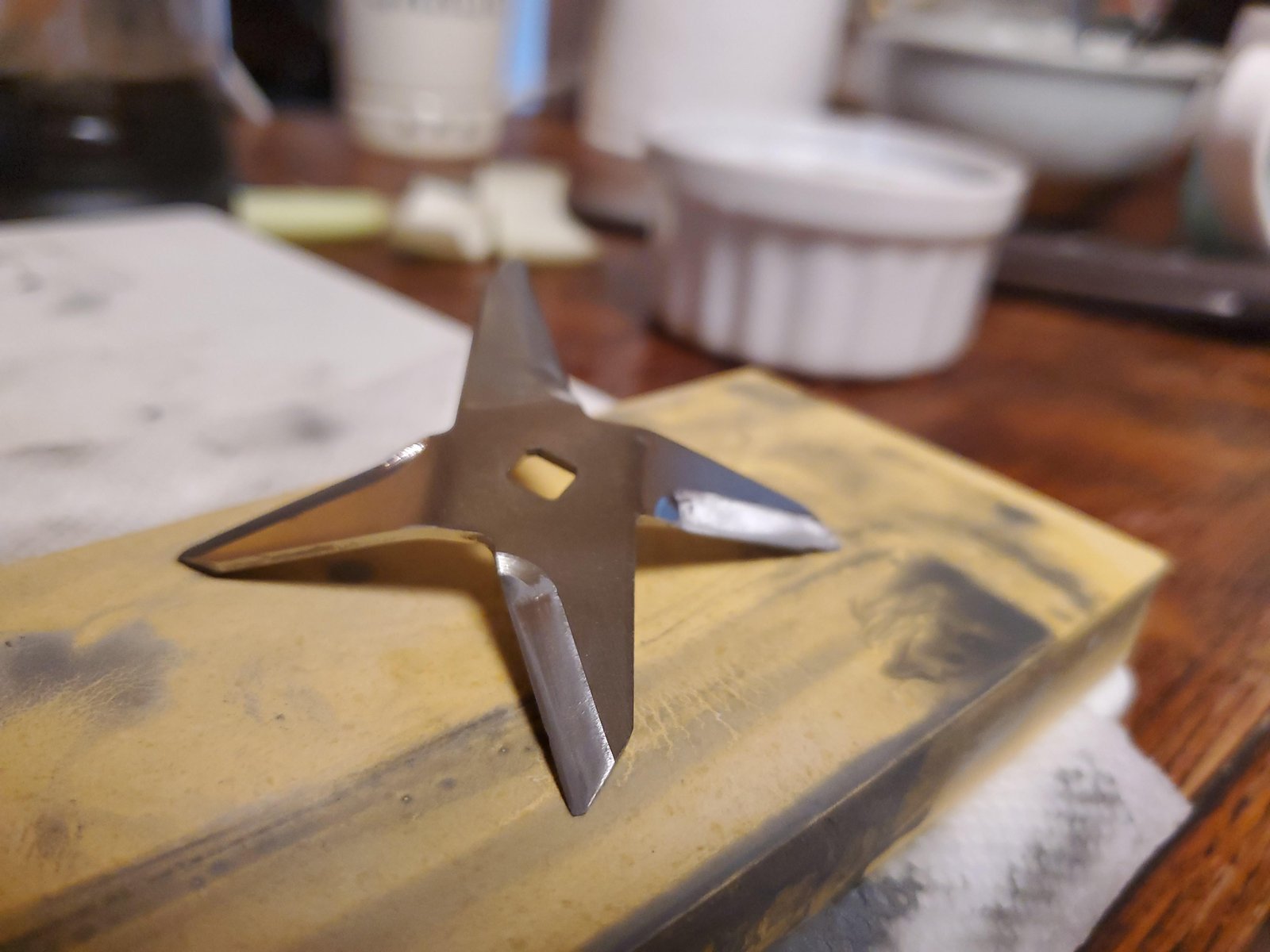Worn Vitamix blender blades on a kitchen counter showing need for maintenance